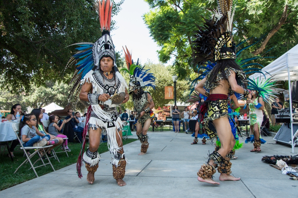 Students and families enjoy a performance by Aztec dancers at the Latino Education Access and Development Conference