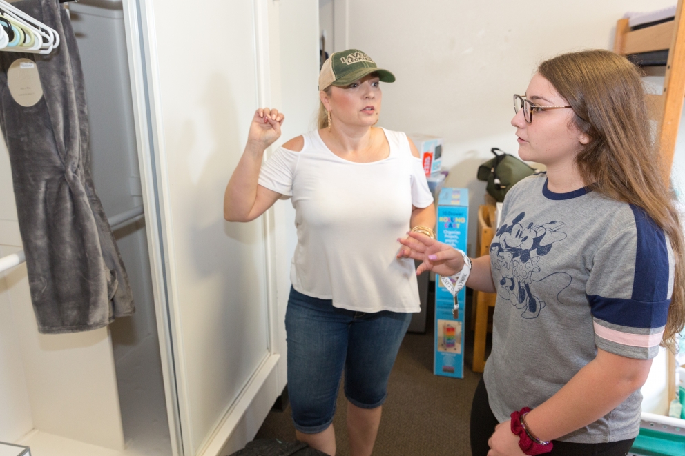 Students and their parents prepare dorms on move-in day.