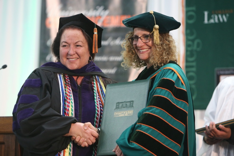 Beverly Shelly Vorwaller and President Devorah Lieberman at the College of Law 2018 Commencement Ceremony