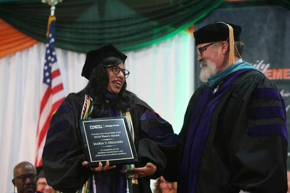 Maria Delgado and Interim Dean Kevin Marshall during COL's 2018 Commencement Ceremony