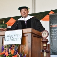 A speaker onstage at the 2018 Commencement Ceremony