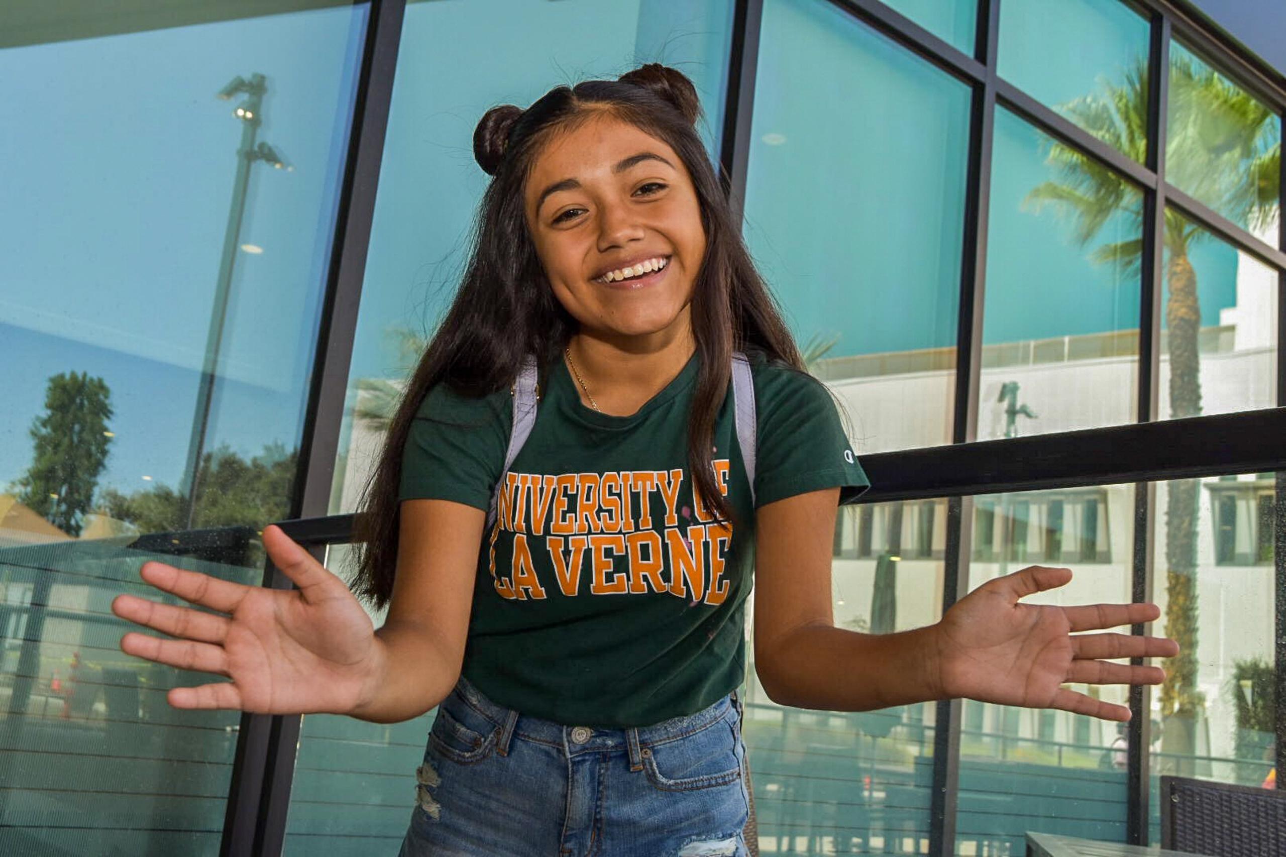 Student smiles on move-in day