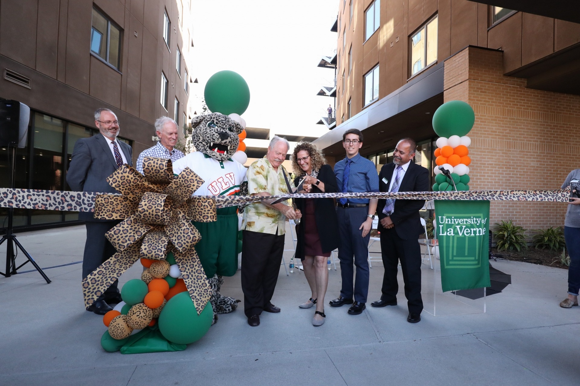 President Devorah Lieberman and La Verne Mayor Don Kendrick cut the ribbon at the grand opening celebration for Citrus Hall and The Spot at the University of La Verne.