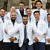Students smile at the Physician's Assistant Program white coat ceremony.