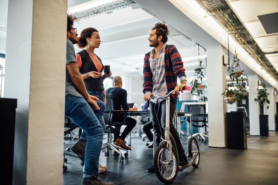 Students talking in an office