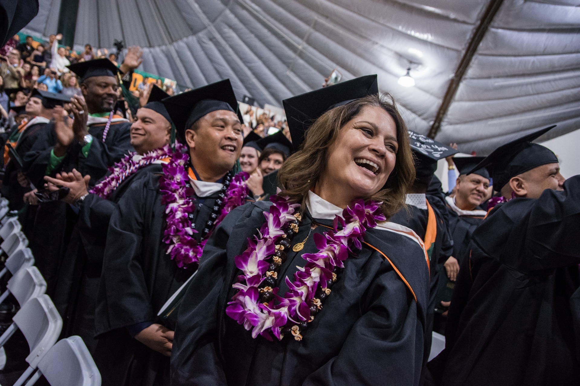 Students smiling at graduation