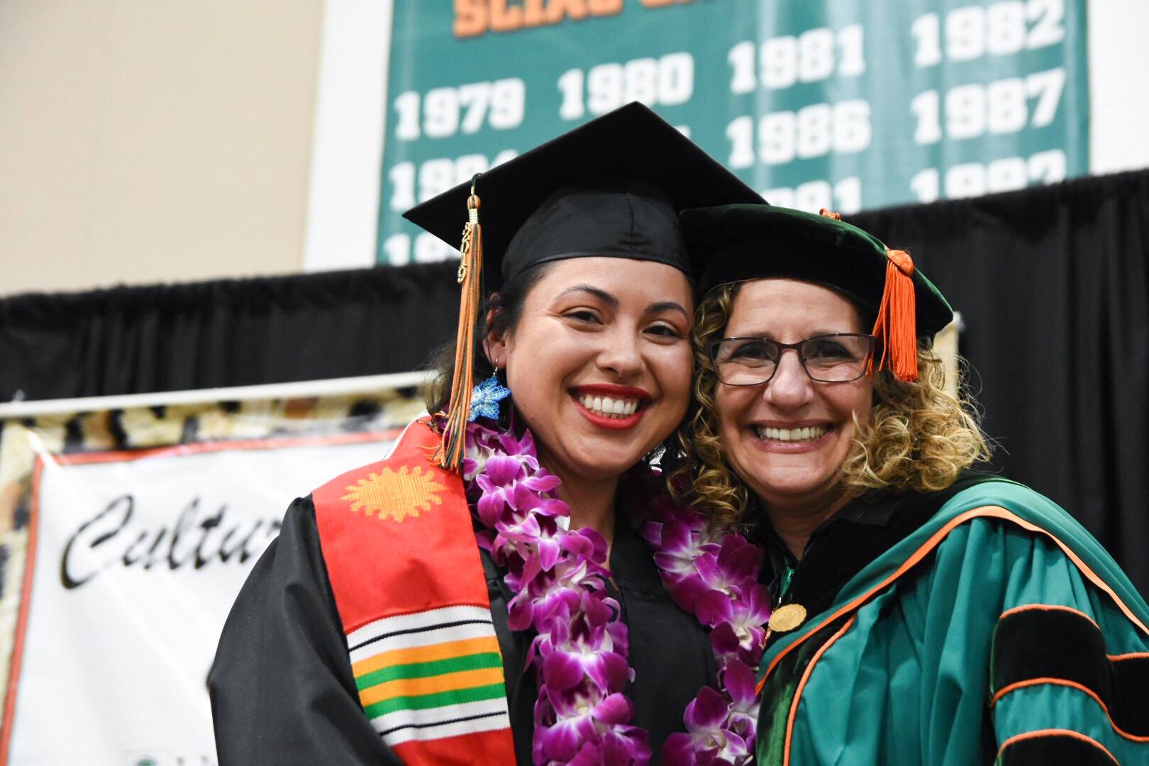 Female student smiles with President Devorah Lieberman