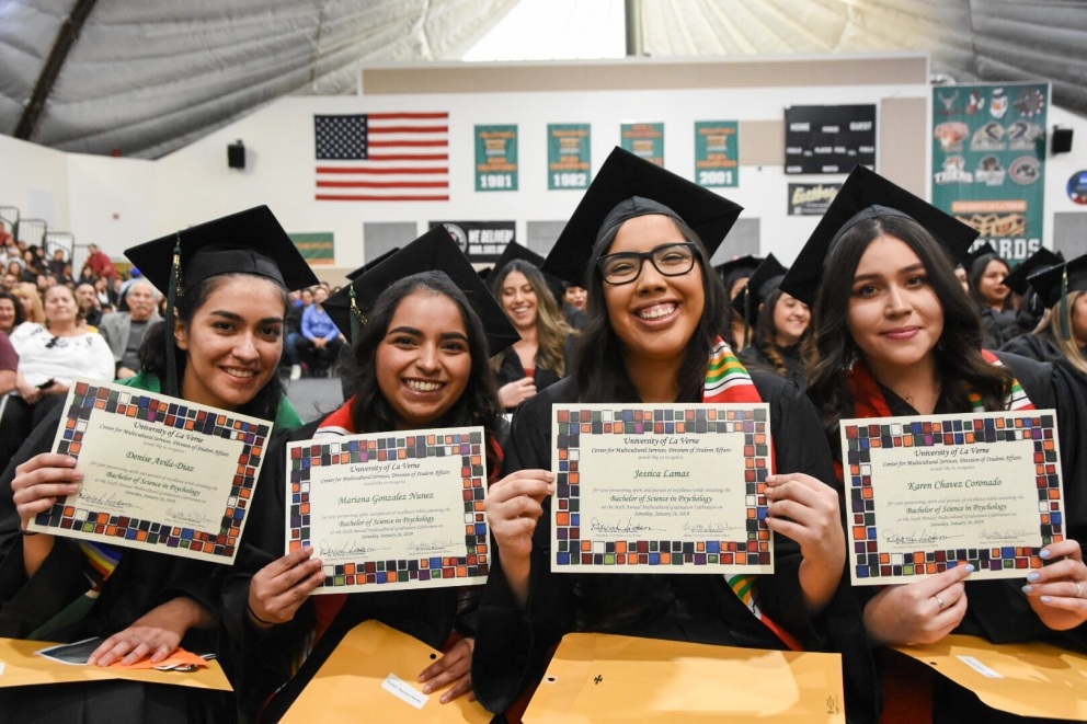 Students sit during cultural celebration