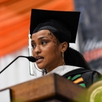 Female student speaking on stage