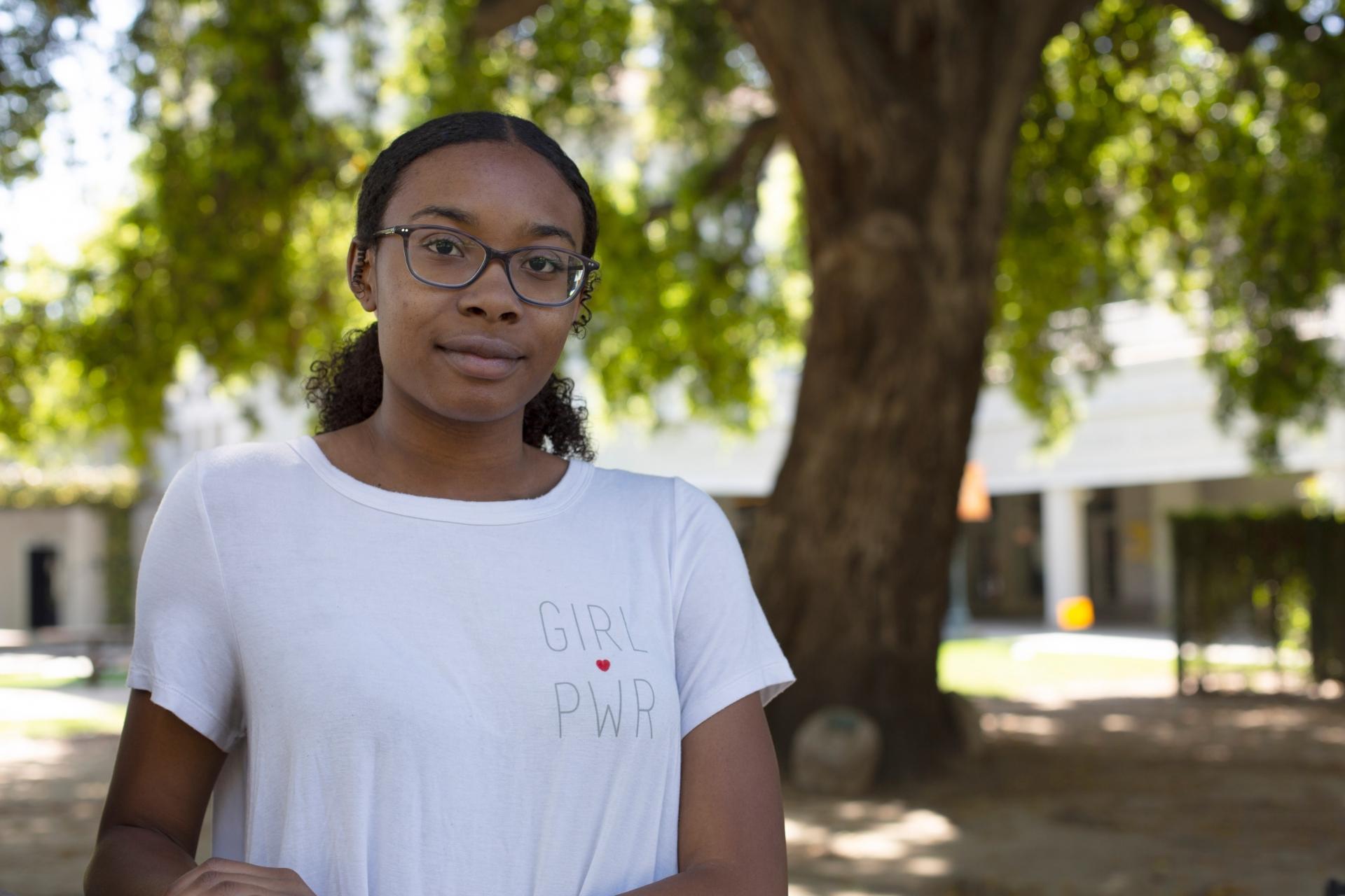 Student Dyamond Gray poses in Sneaky Park