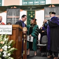 President Lieberman shakes guests' hands at commencement.