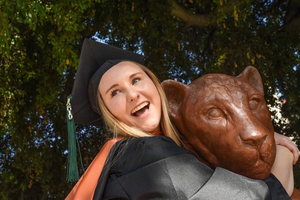 Female student hugging the mascot