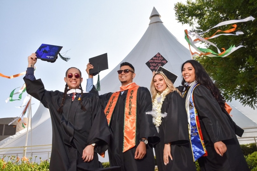 Group of student holding their caps