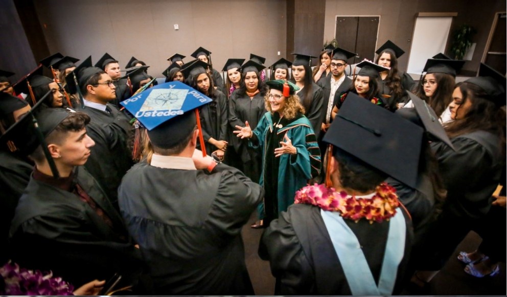 University president with students