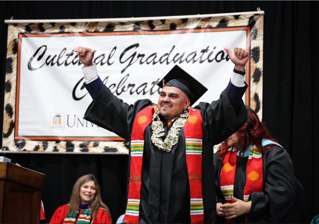 Student celebrates on stage