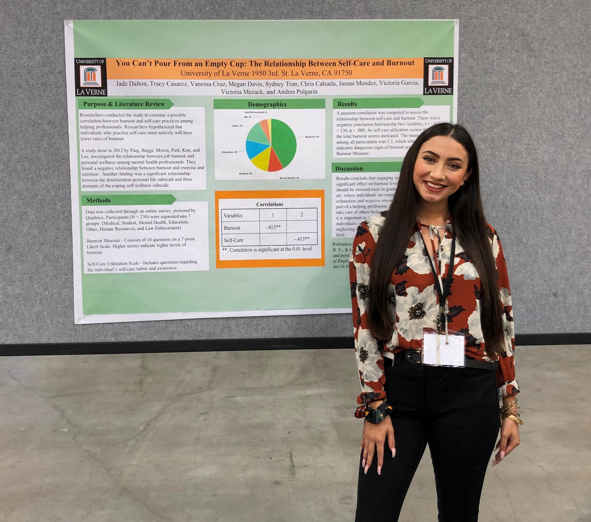 Female student in front of poster board