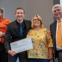 Students present check to charity