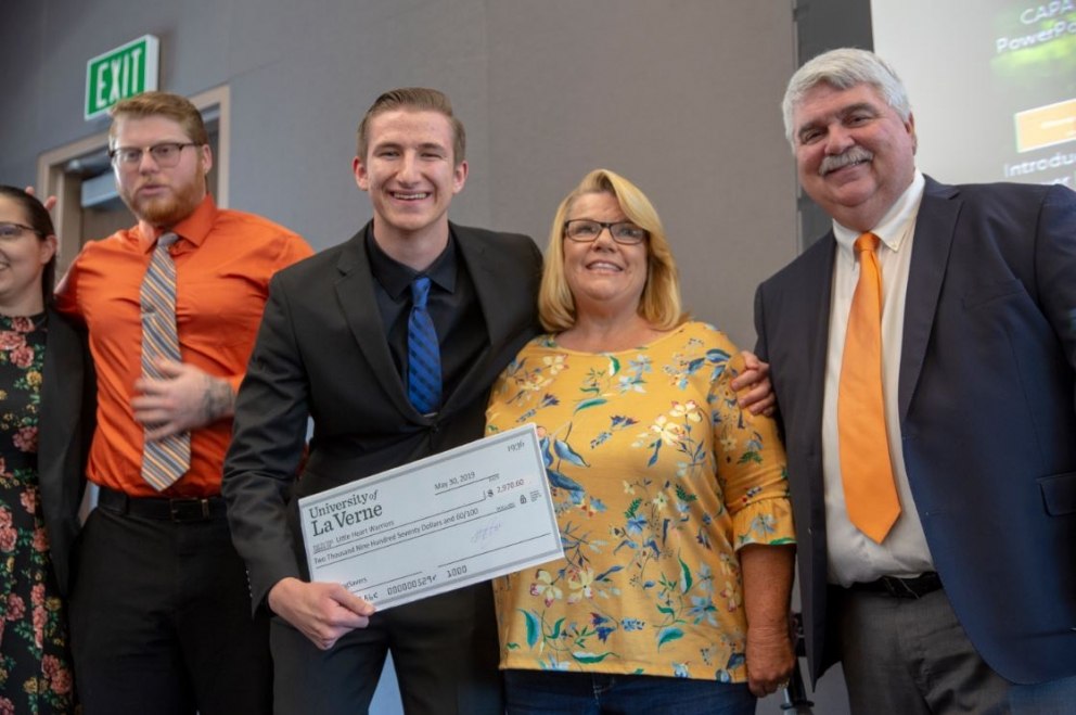 Students present check to charity