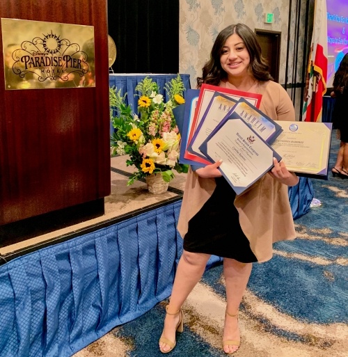 Cynthia Ramirez holding certificate