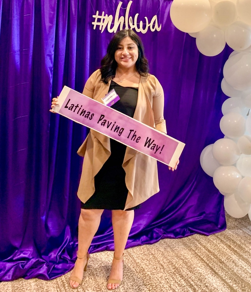 Cynthia Ramirez holding sign