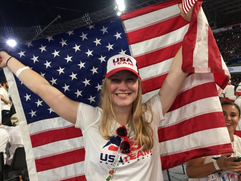 Female athlete holding American flag