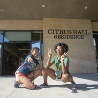 Students stand in front of Citrus Hall