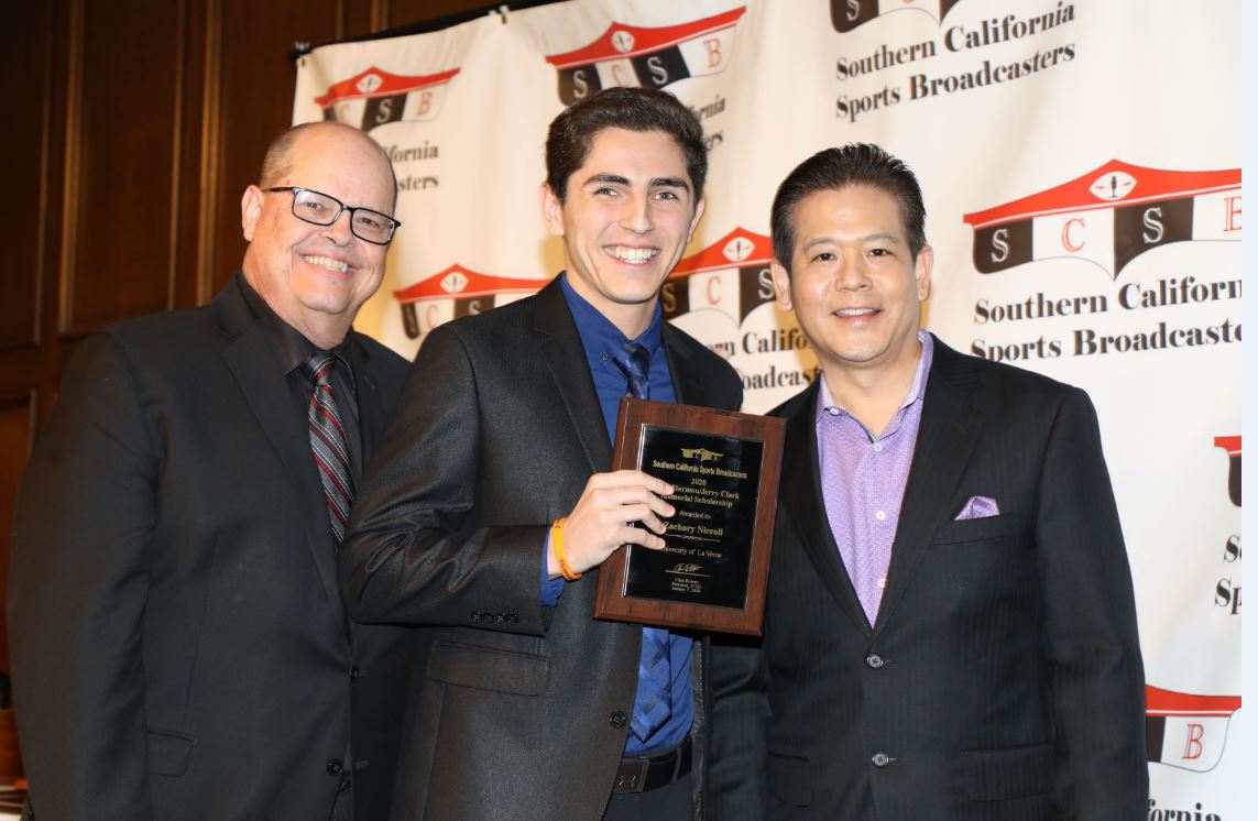 Zachary being presented with award