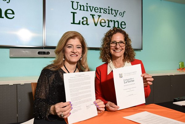 Devorah Lieberman, president of the University of La Verne, and Lady Sohair A. Salam Saber, president of the Hague Institute, sign documents to formalize the relationship during a ceremony on the university’s La Verne campus on Feb. 1, 2020.