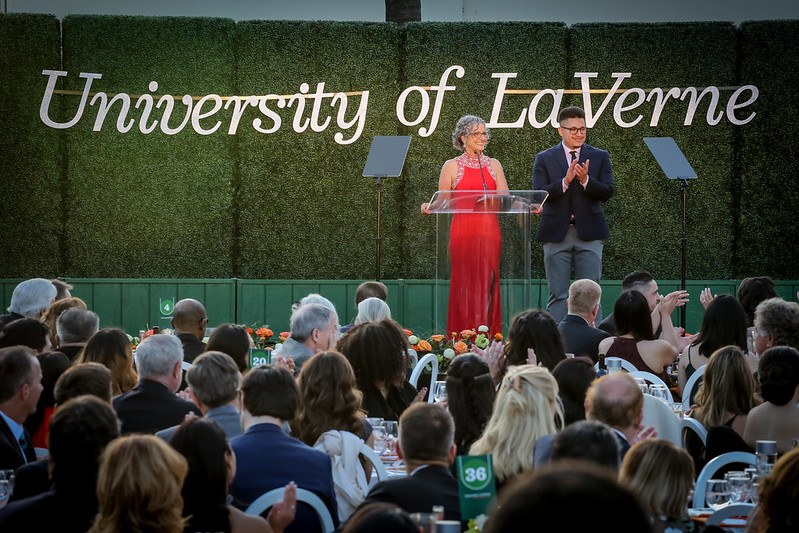 University of La Verne President Devorah Lieberman on stage at the 2022 Scholarship Gala with student Ian Mendoza.