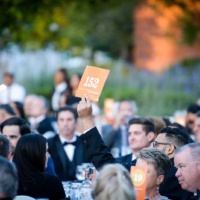 Guests participate on the paddle raise at the University of La Verne's 2022 Scholarship Gala.