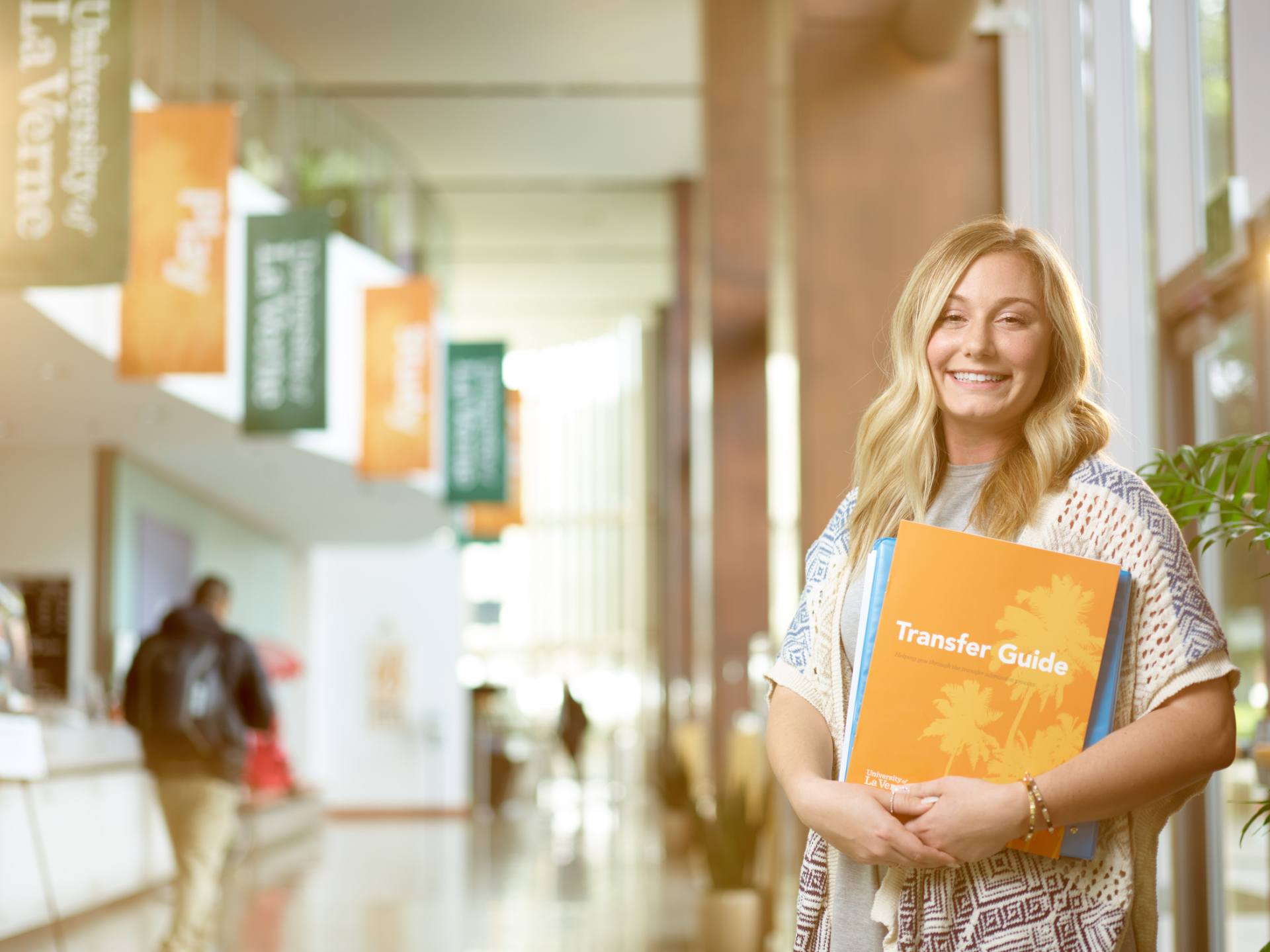 Photo of a University of La Verne transfer student in the Abraham Campus Center.