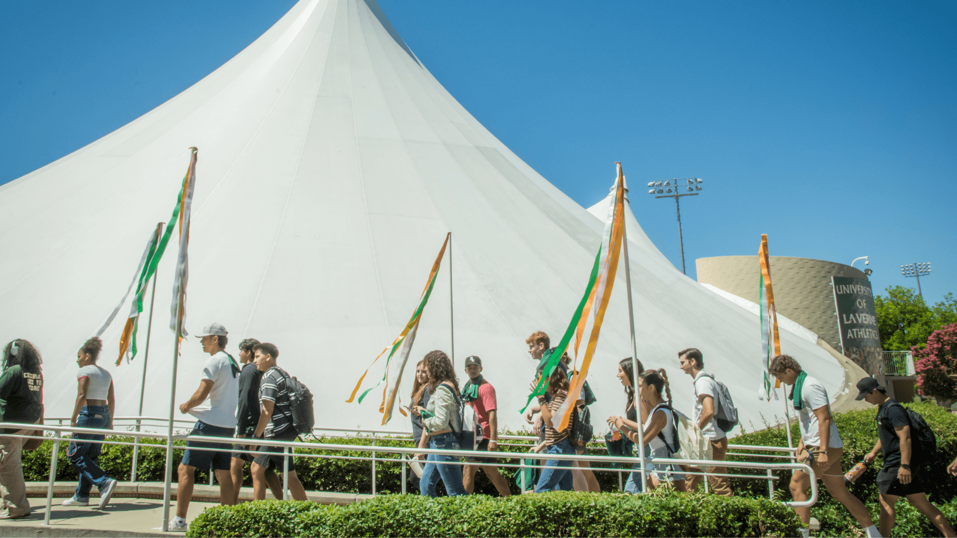 Students walking into the Super Tents during Convocation 2023-2024