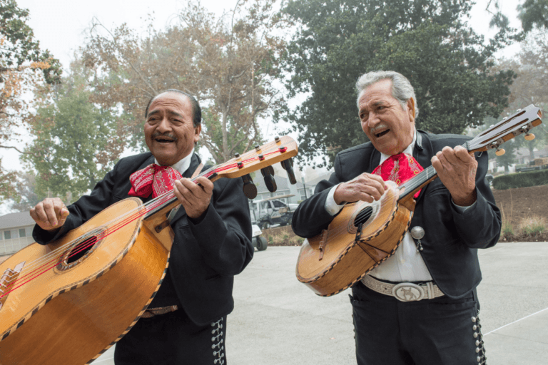 Two Mariachi players with instruments at ULV